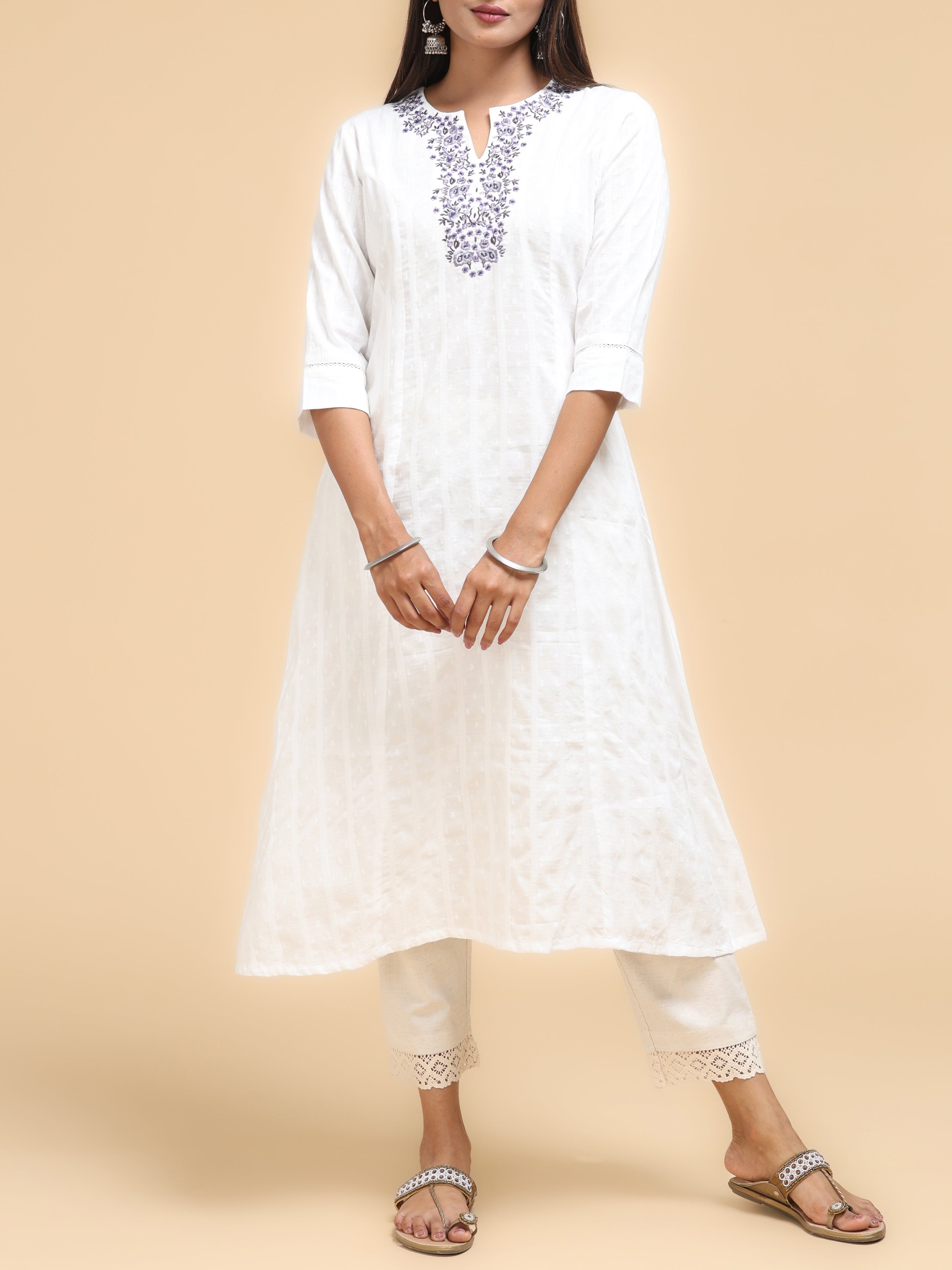 Women Wearing Off-White Modal Chanderi Kurti With Embroidery And Sequins Work
