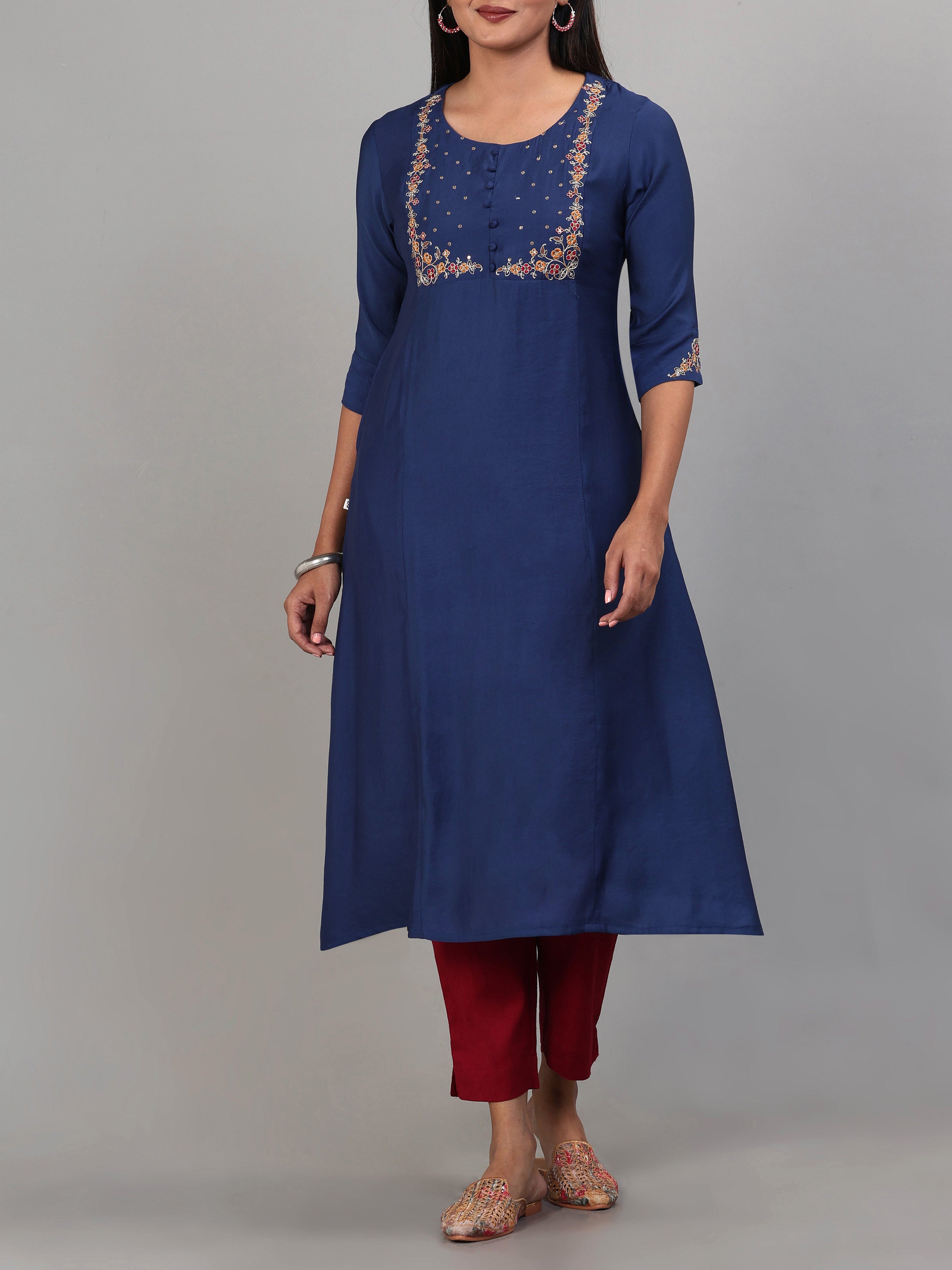 Women Wearing Aqua Blue Poly Viscose Kurti With Embroidery And Matching Bottom