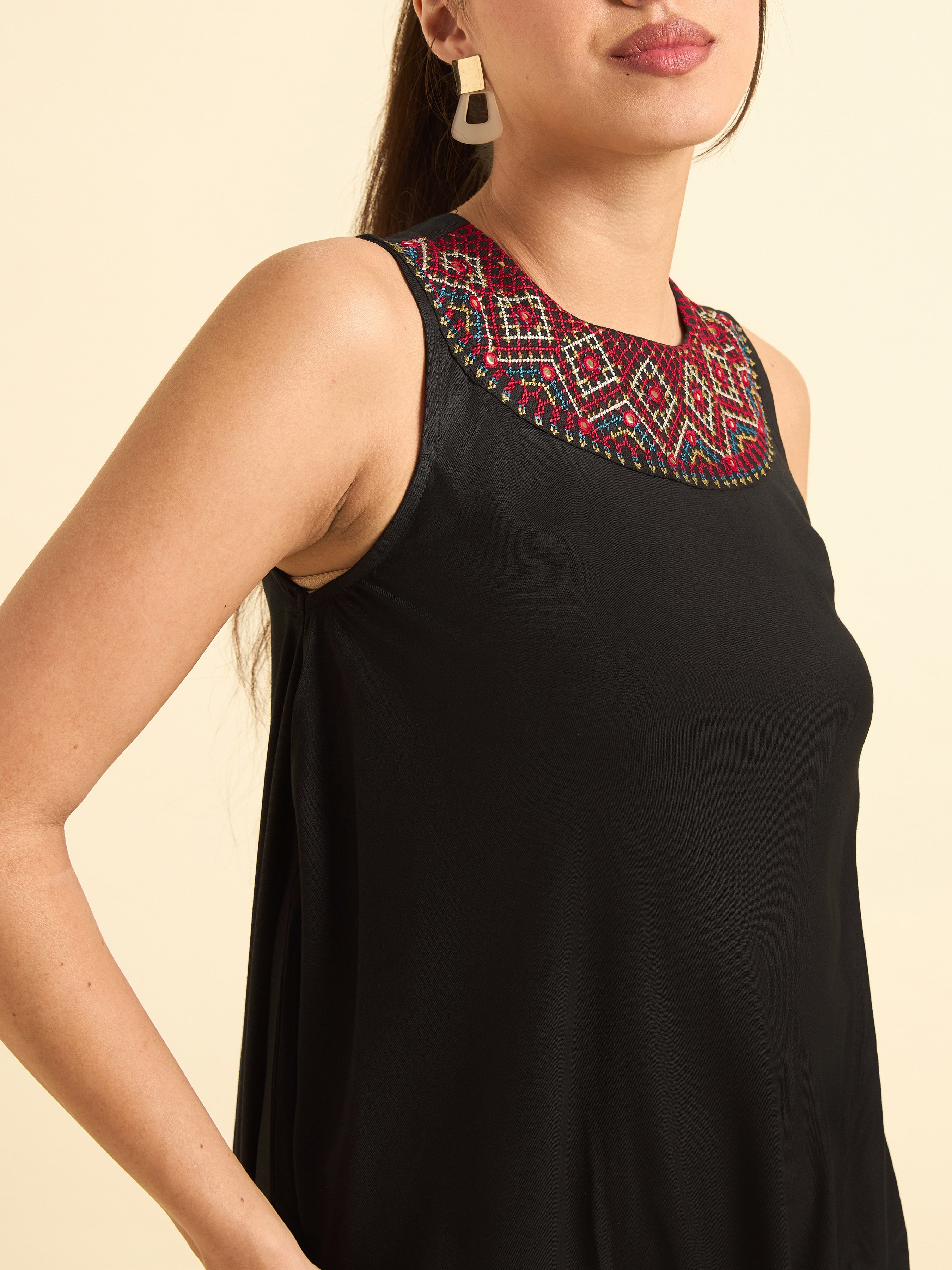 Women Wearing Black Colour Viscose Plain Flared Kurti With Mirror Work Embroidery