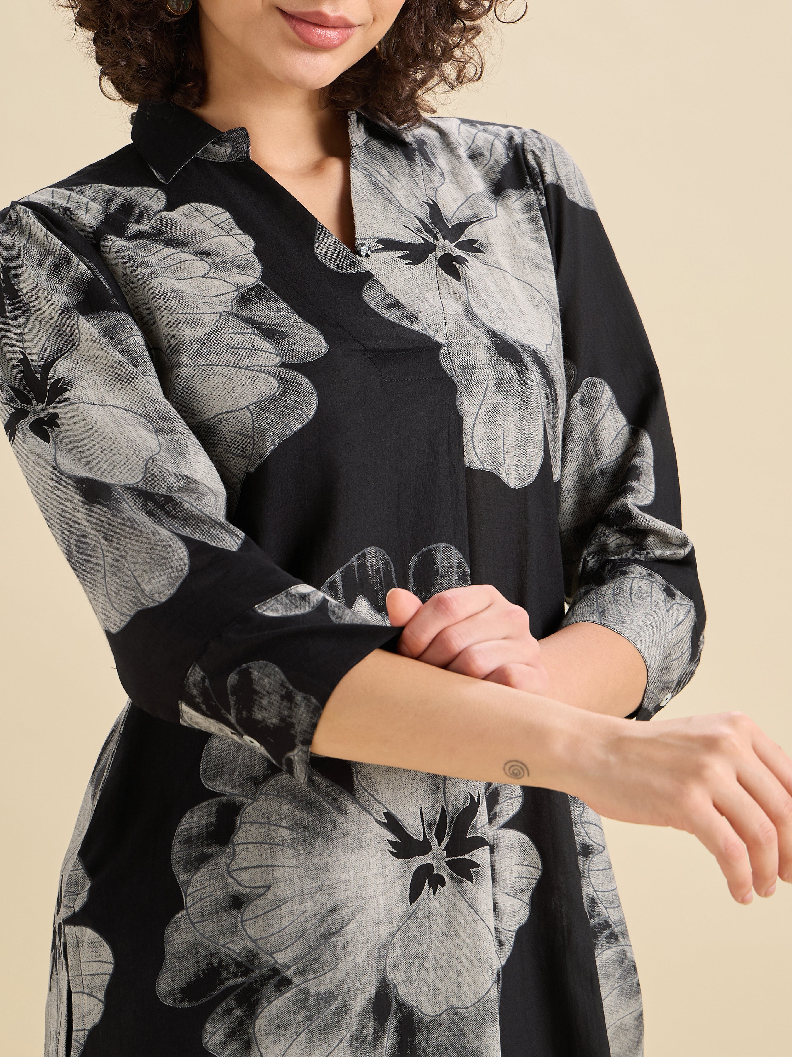 Black And White Pure Cotton Printed Slited Kurti With Knife Pleats And Curved Hem Line