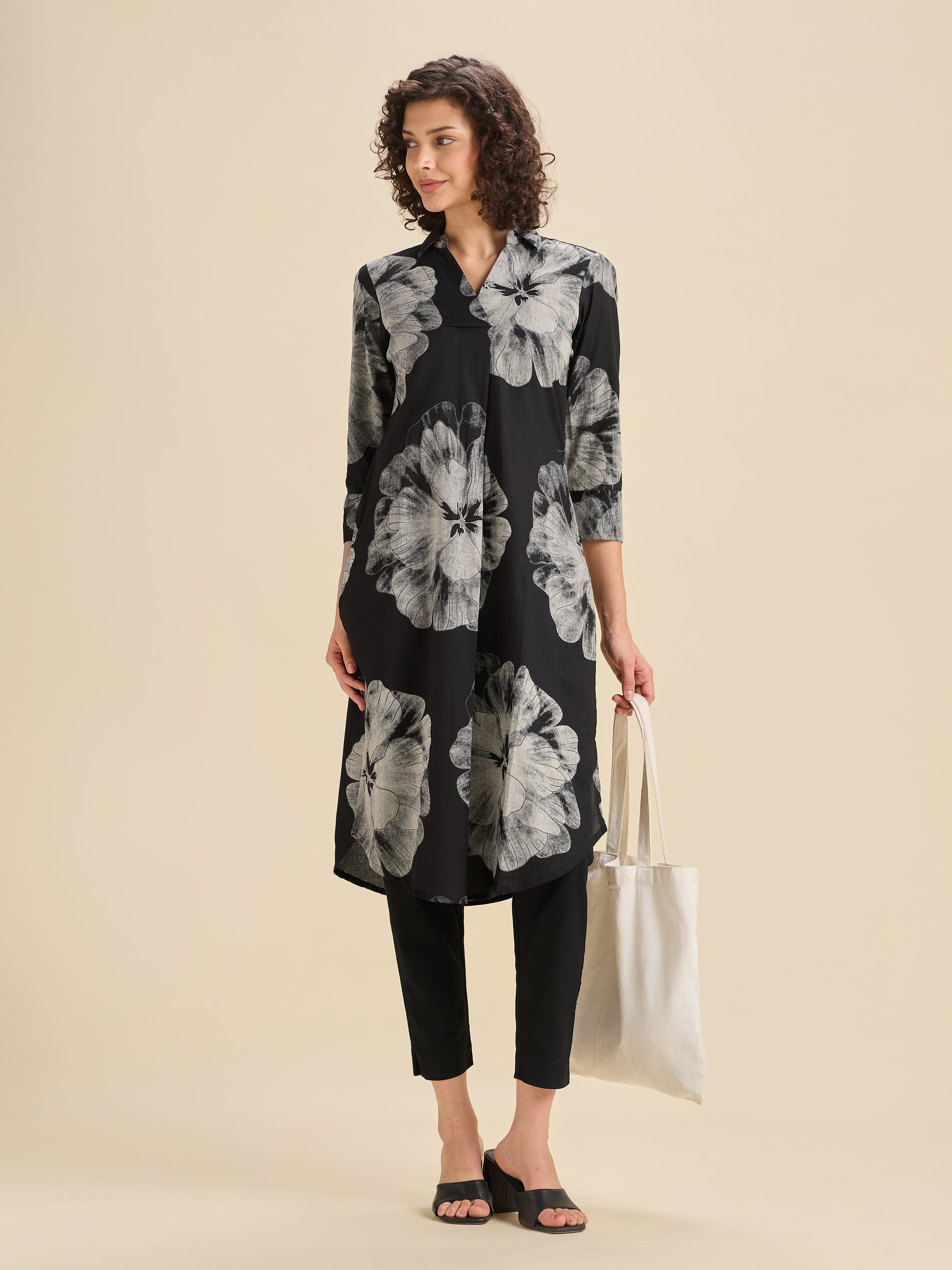 Black And White Pure Cotton Printed Slited Kurti With Knife Pleats And Curved Hem Line