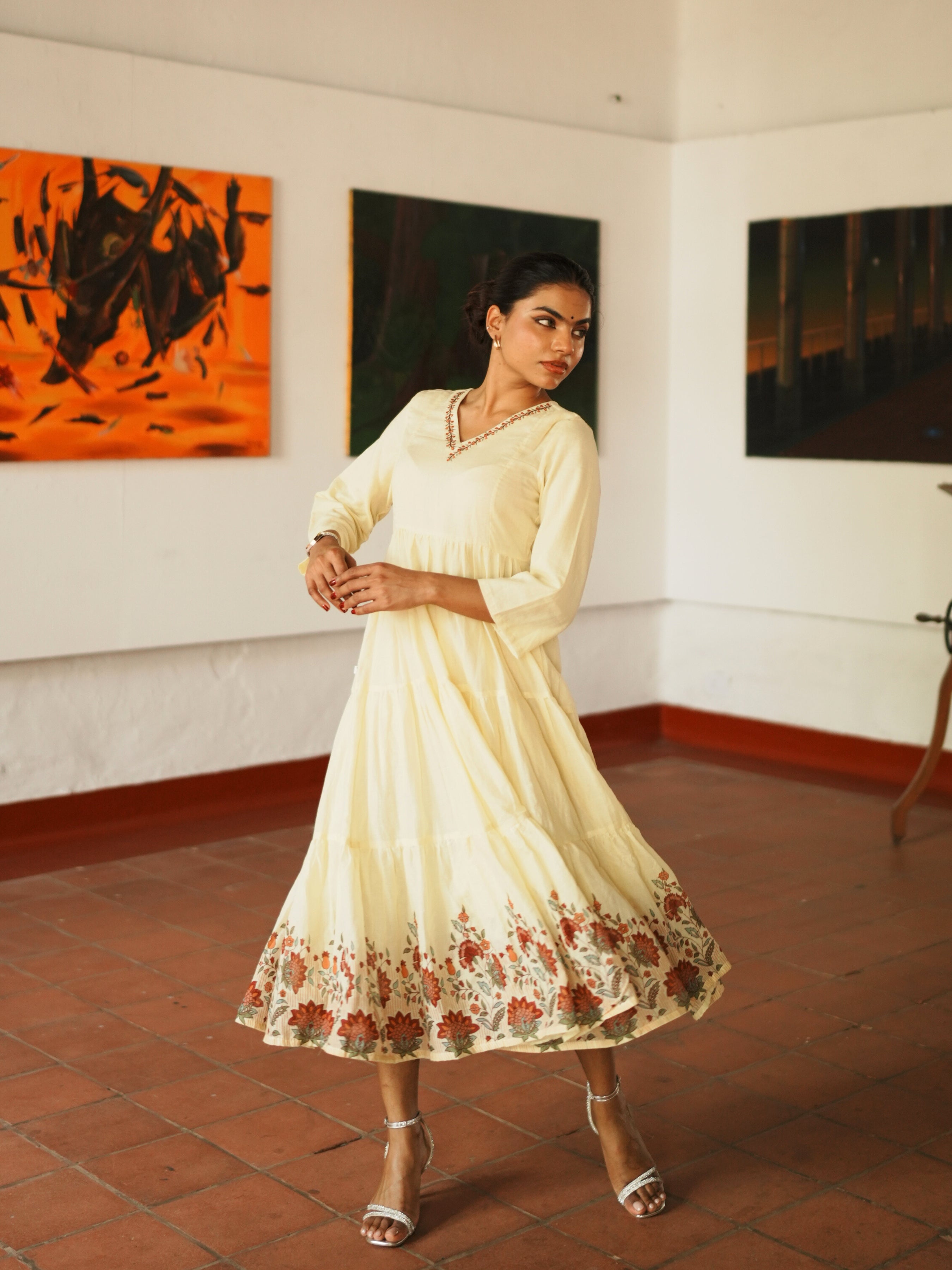 Pale Yellow Pure Cotton Tiered Kurti With Print And Embroidery