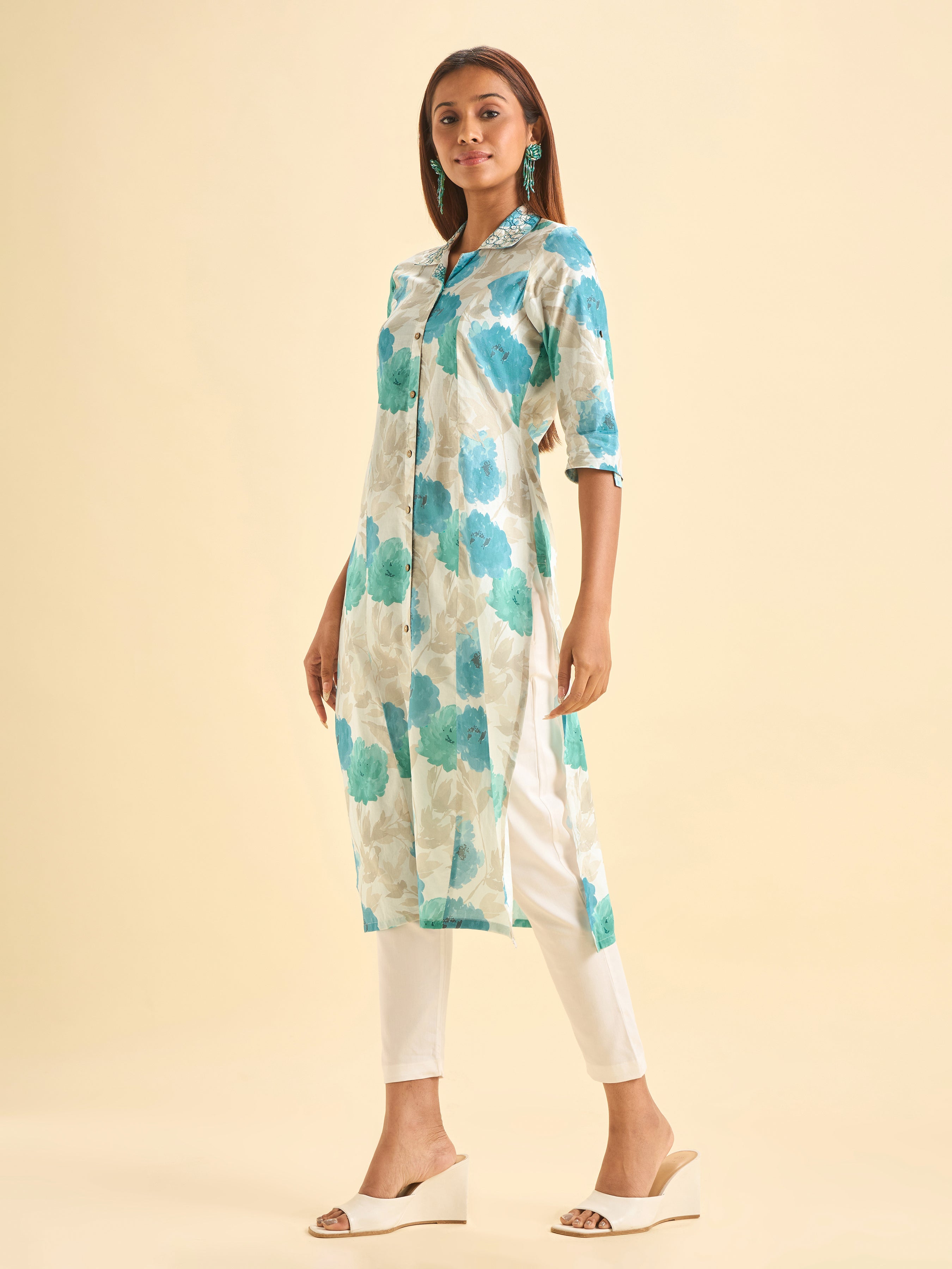 Ivory And Blue Colour Pure Cotton Printed Slited Kurti With Princesscut And Embroidery