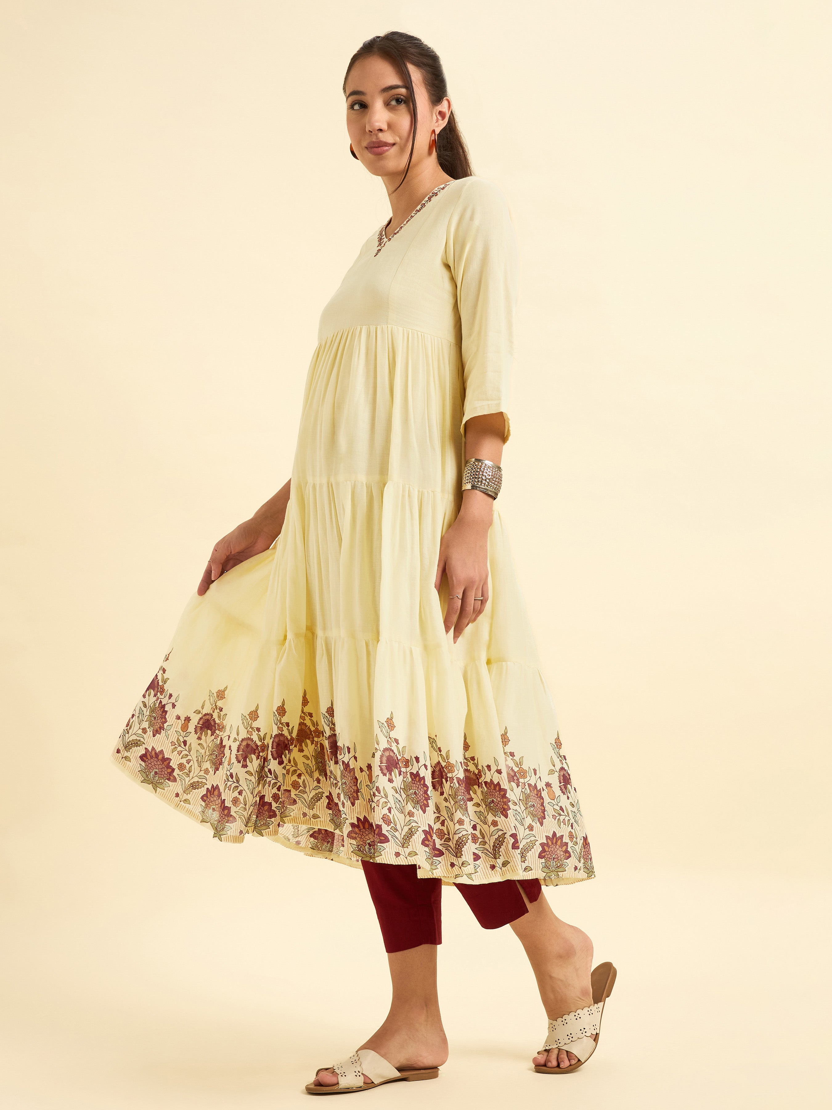 Pale Yellow Pure Cotton Tiered Kurti With Print And Embroidery