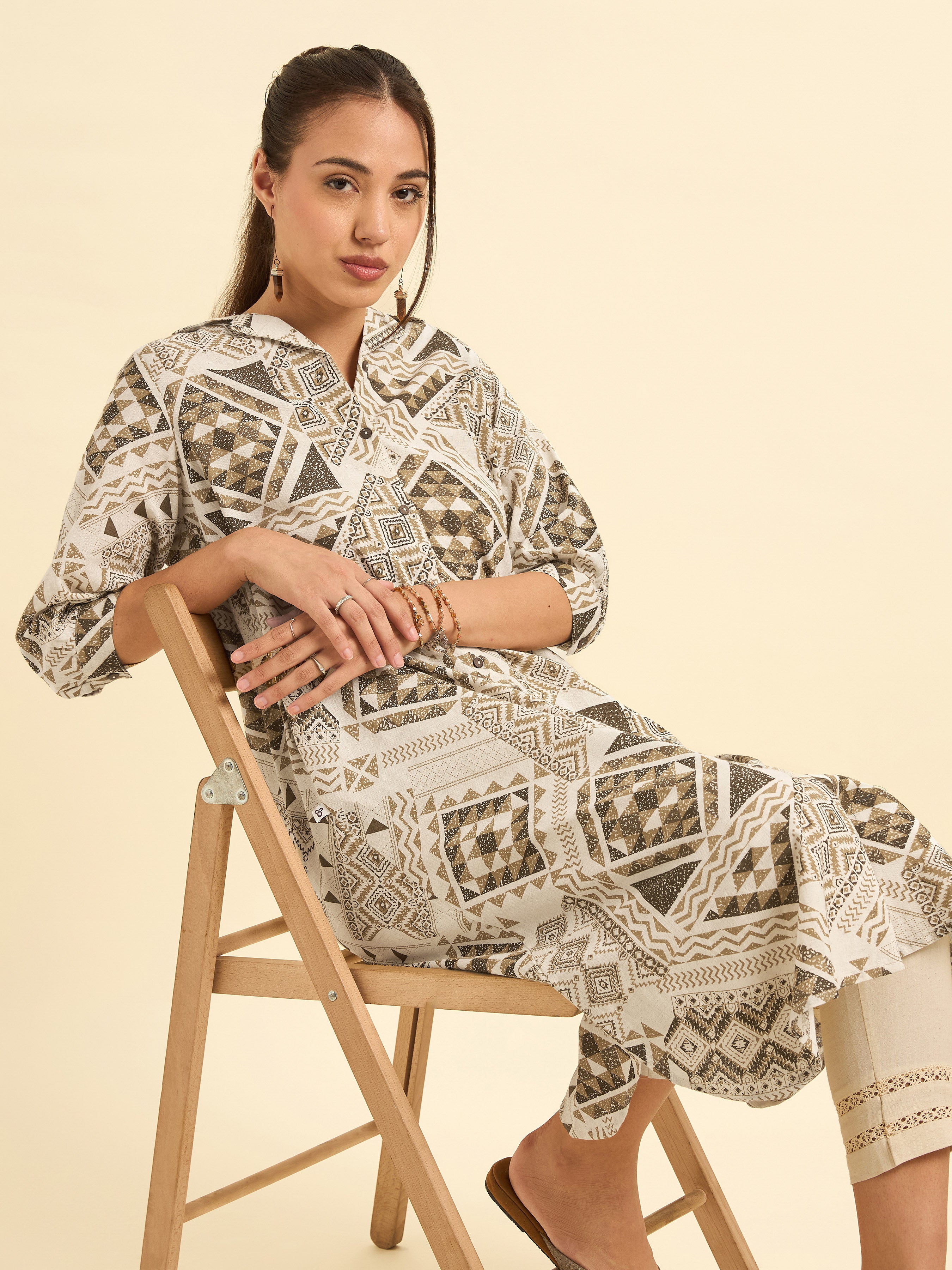 Women Wearing Ivory Multi Cotton Flax Printed Flared Kurti With Relaxed Fit