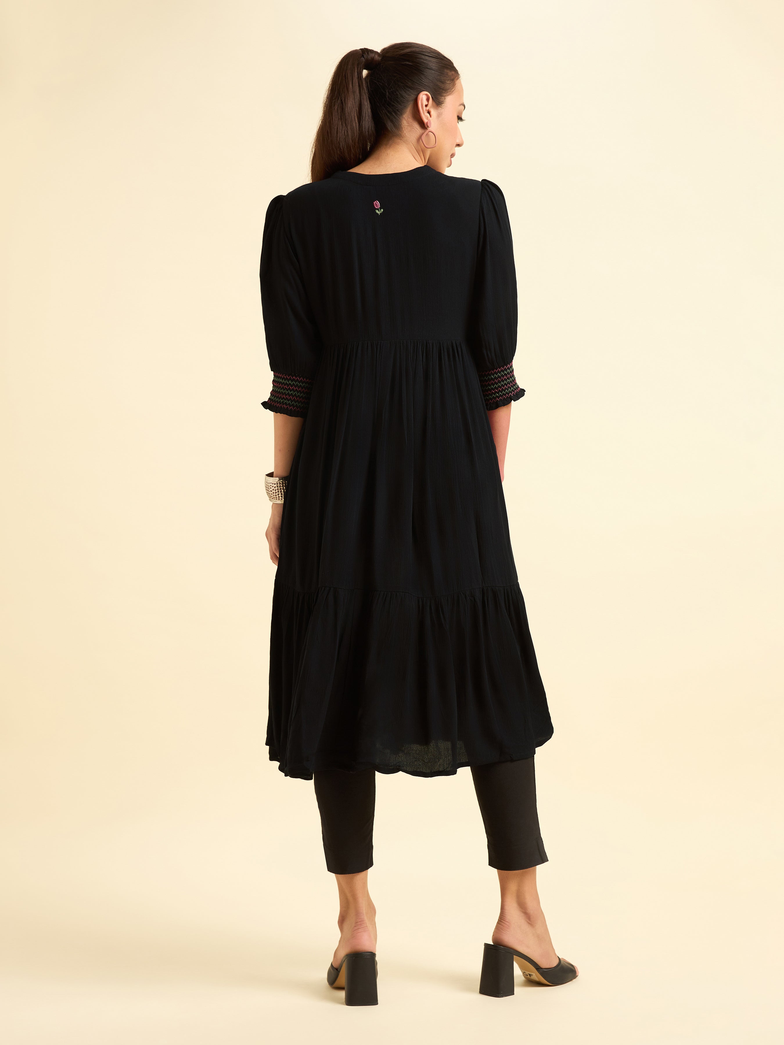 Women Wearing Black Wrinkle Viscose Flared Plain Kurti With Embroidery