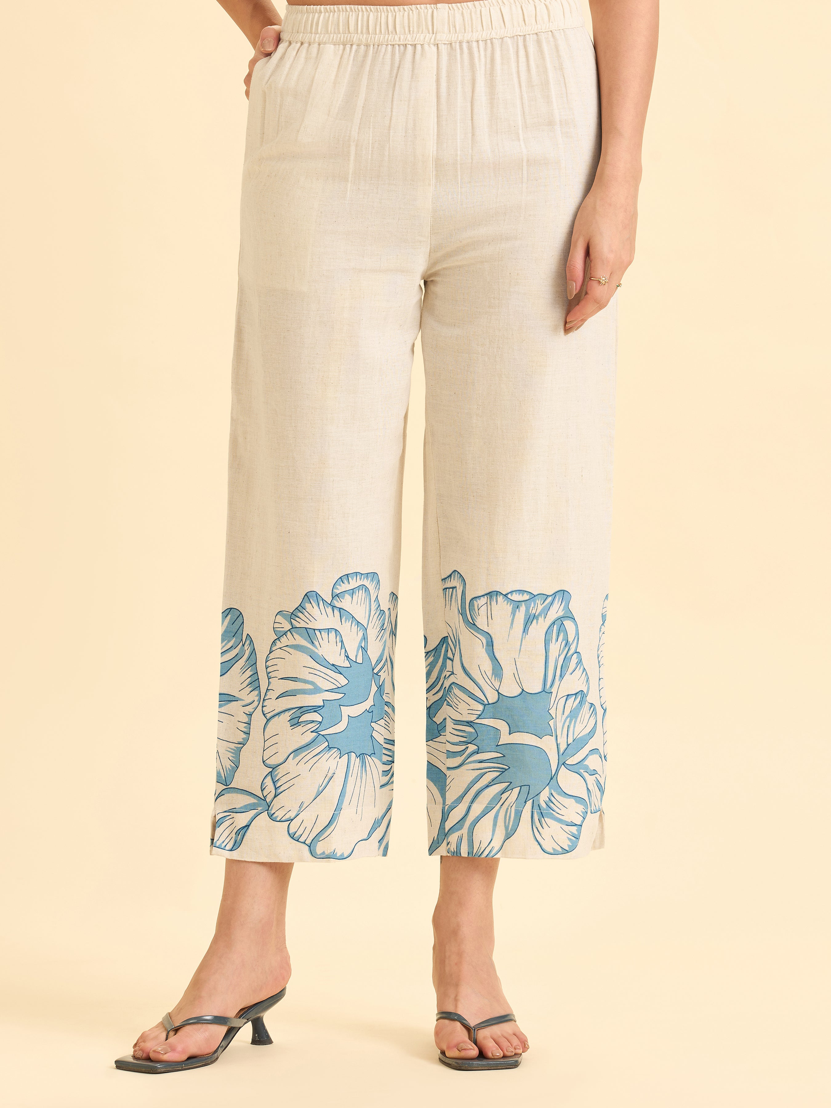 Women Wearing Ivory And Blue Cotton Flax Printed Kurti With Embroidery