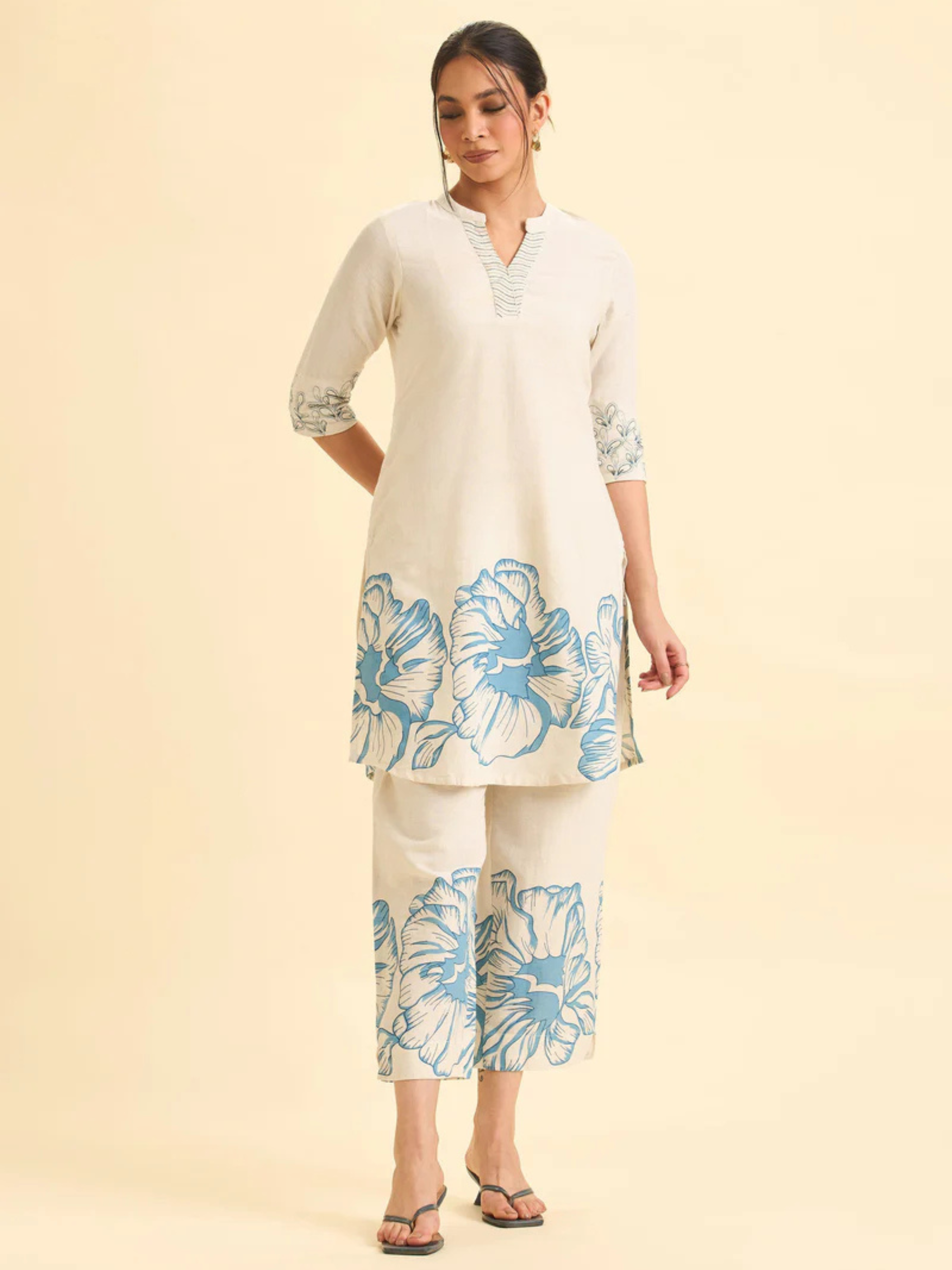 Women Wearing Ivory And Pink Cotton Flax Printed Kurti With Embroidery