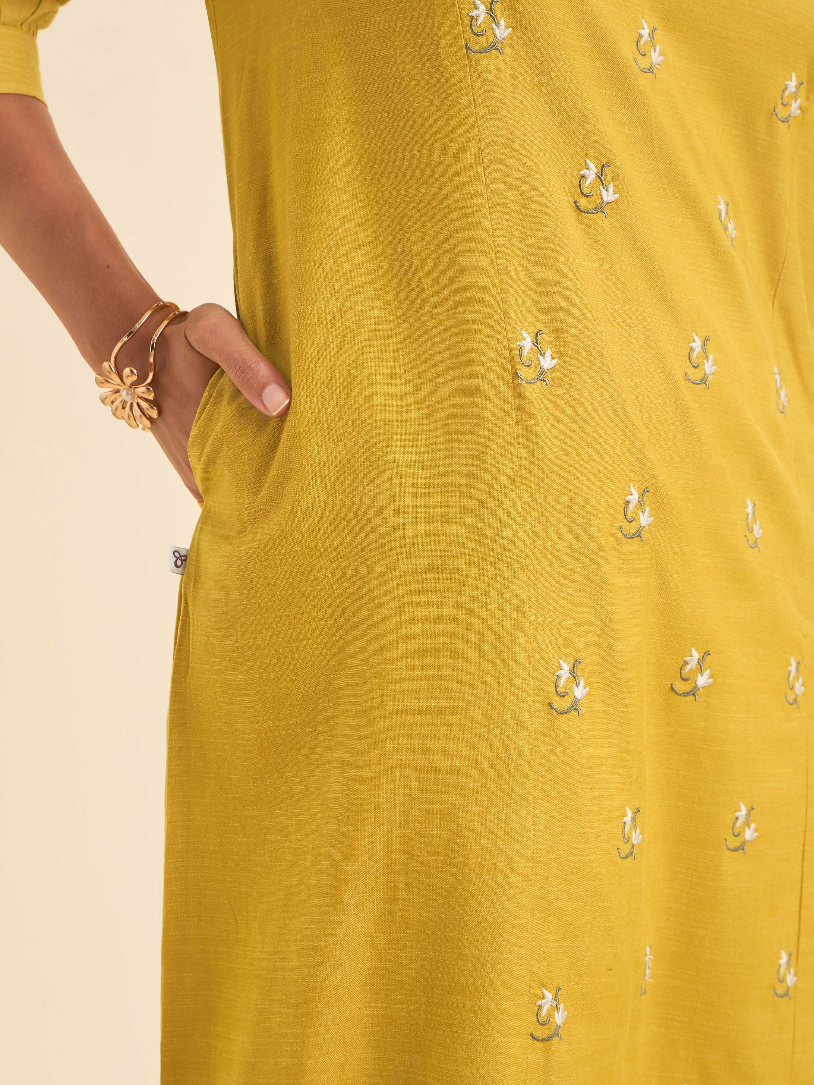 Mustard Cotton Viscose Slub Plain Flared Kurti With Curved Hem And Embroidery