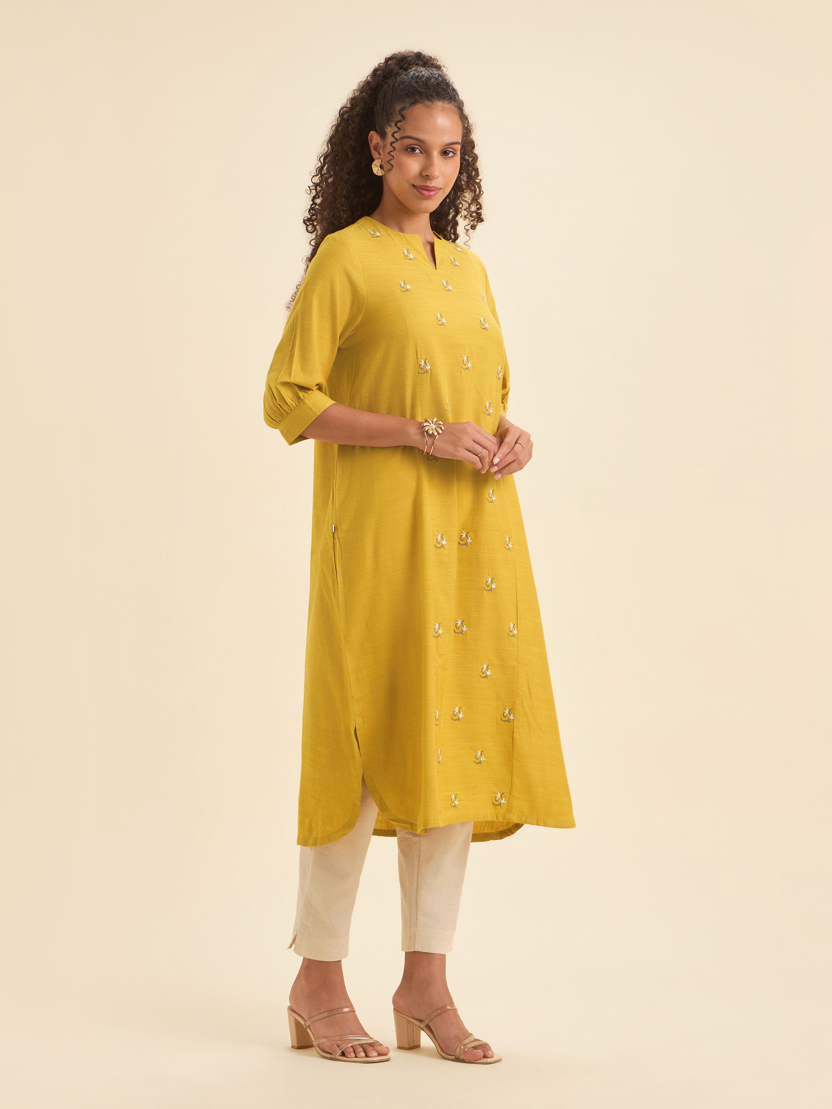 Mustard Cotton Viscose Slub Plain Flared Kurti With Curved Hem And Embroidery