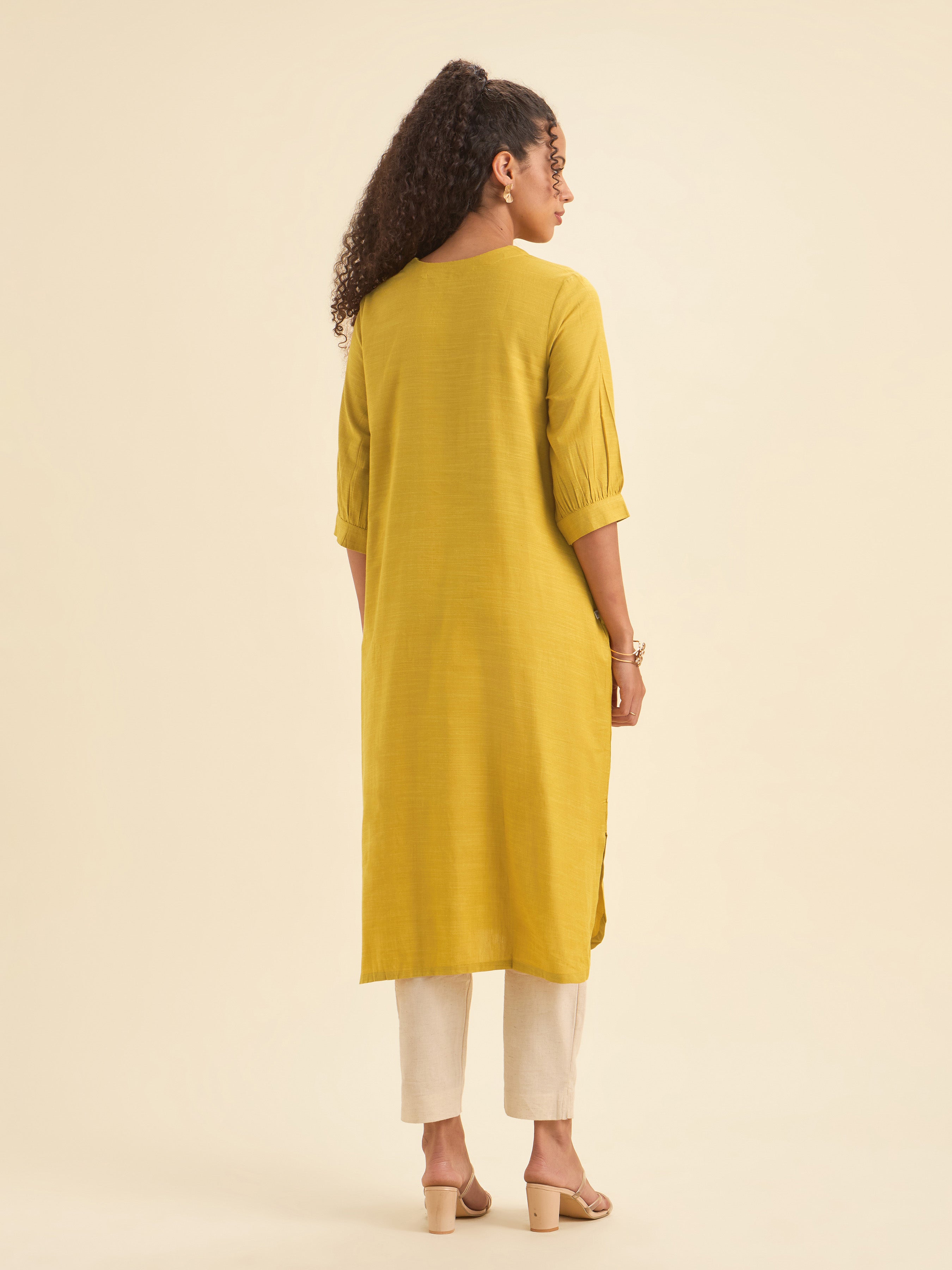 Mustard Cotton Viscose Slub Plain Flared Kurti With Curved Hem And Embroidery