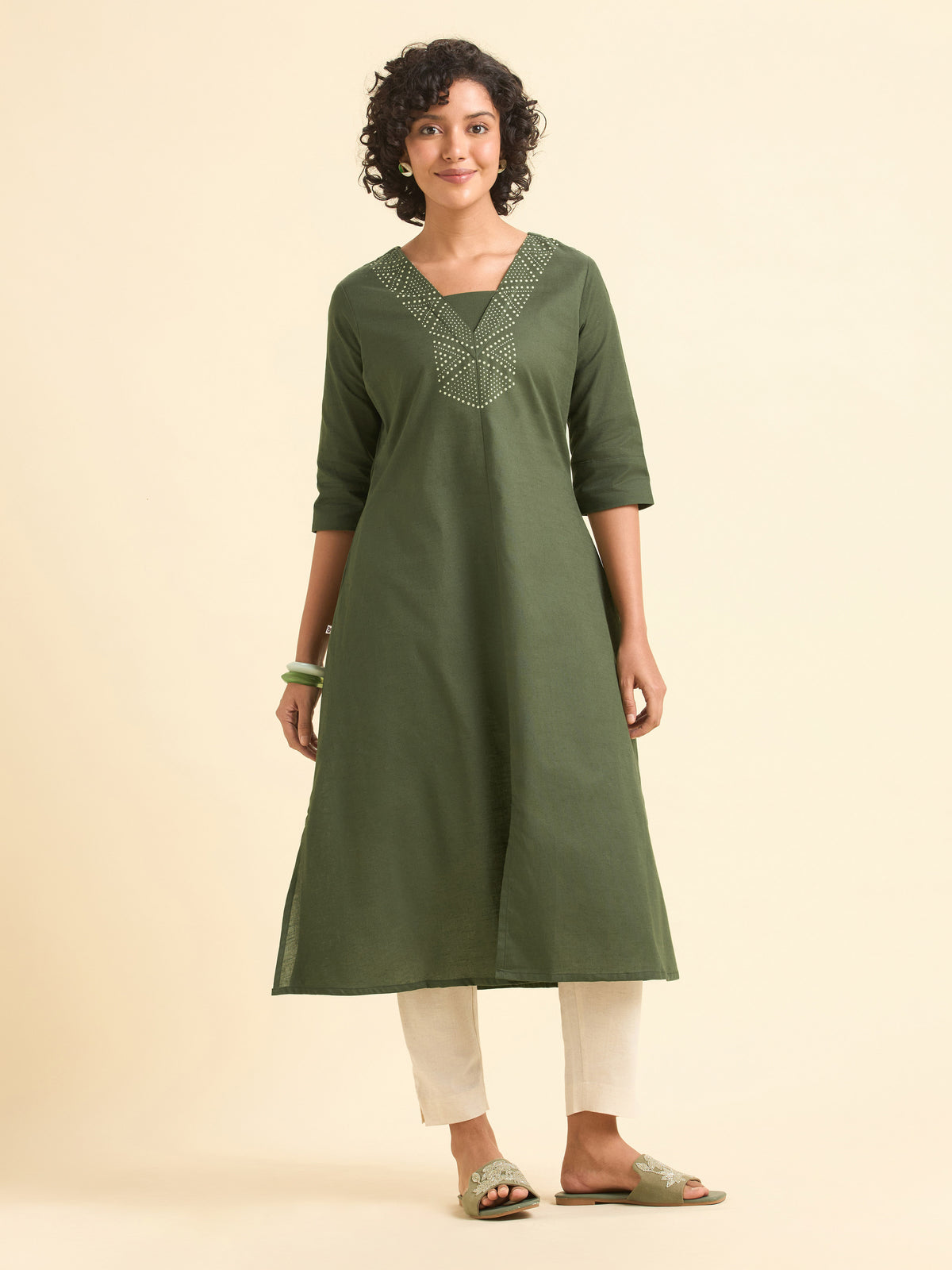 Olive Green Cotton Flared Centre Cut Kurti With Back Yoke And Placement Print