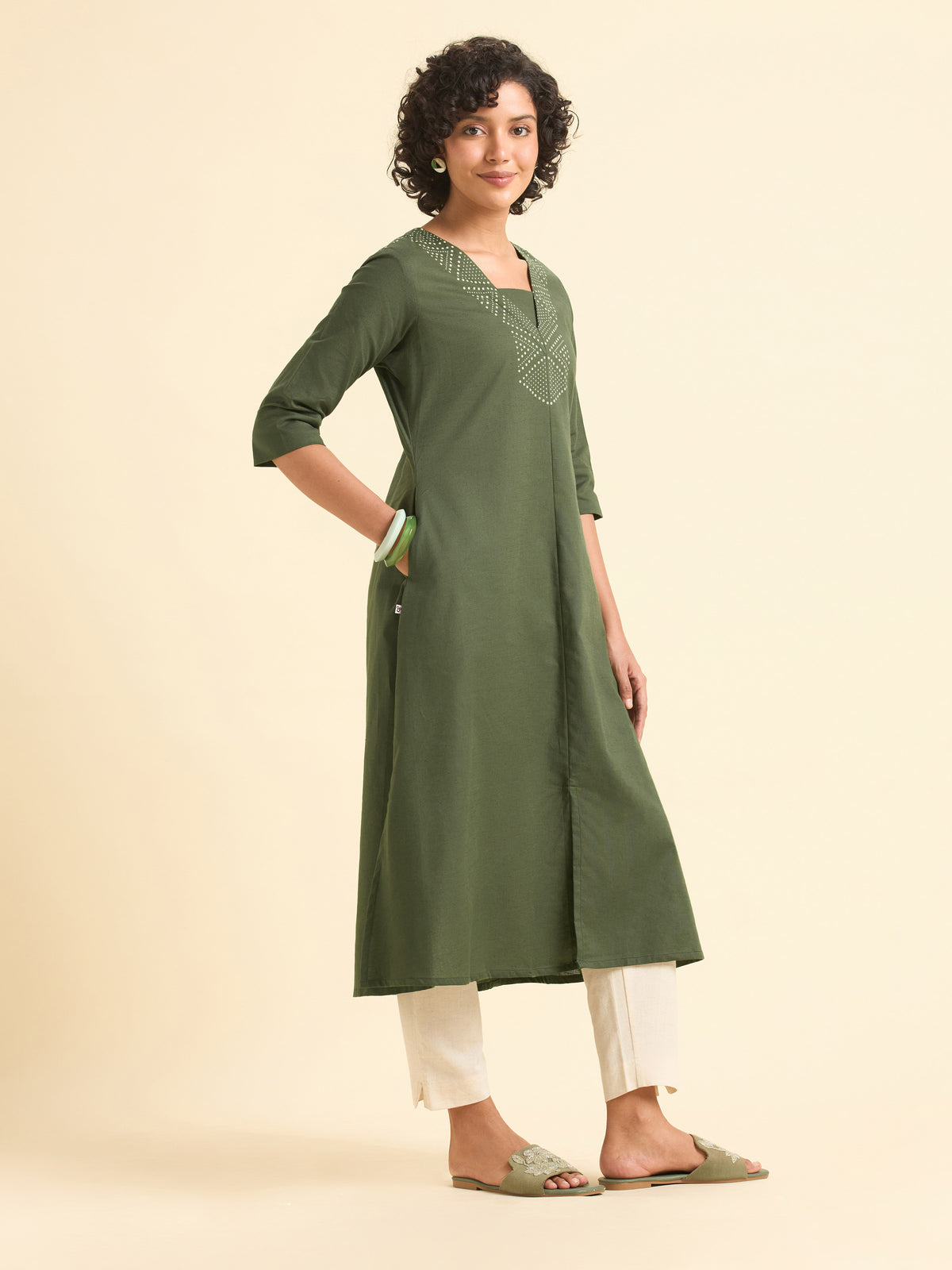 Olive Green Cotton Flared Centre Cut Kurti With Back Yoke And Placement Print