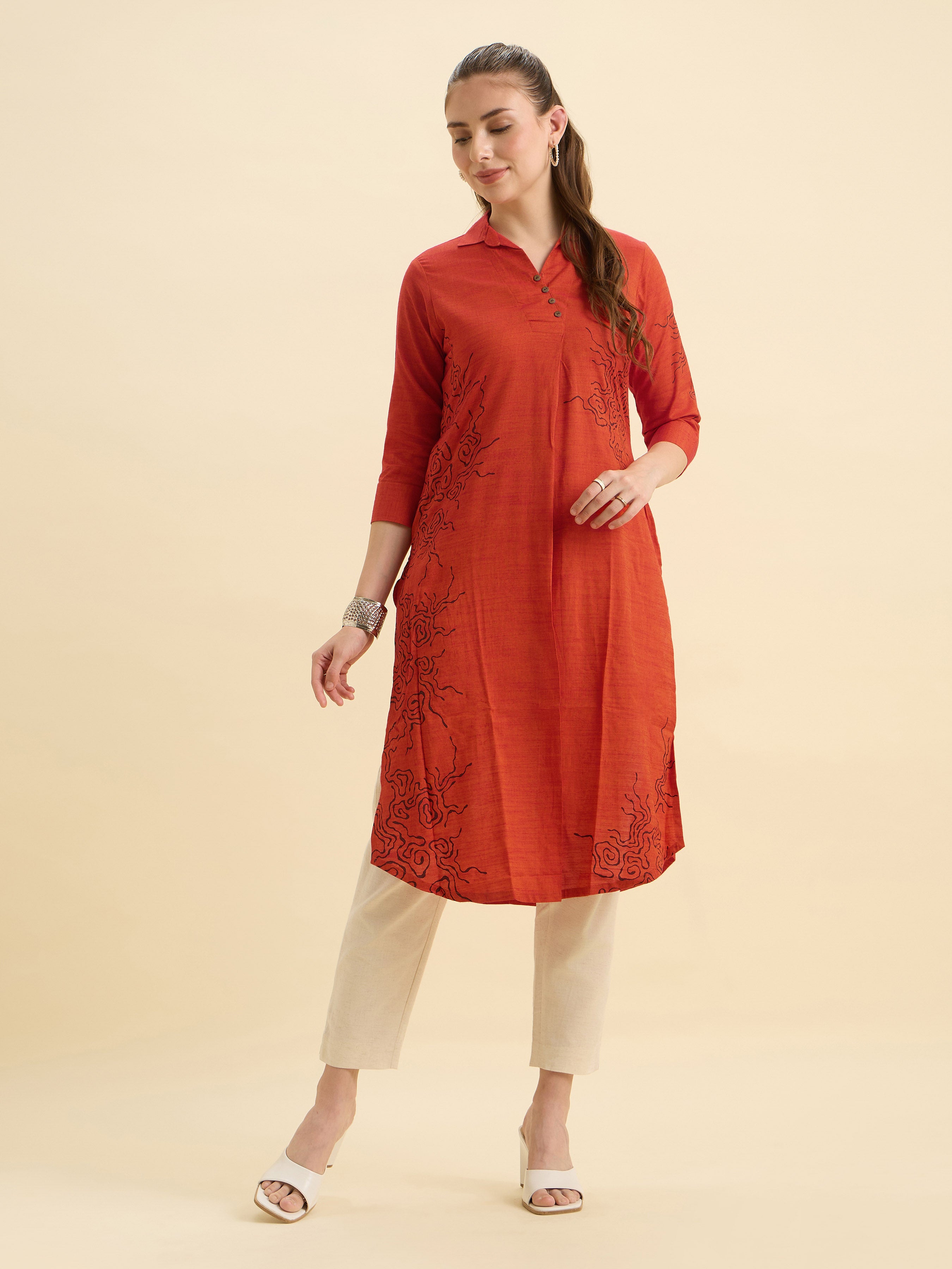 Orange Cotton Viscose Plain Slit Kurti With Placement Print, Knife Pleats & Curved Hemline