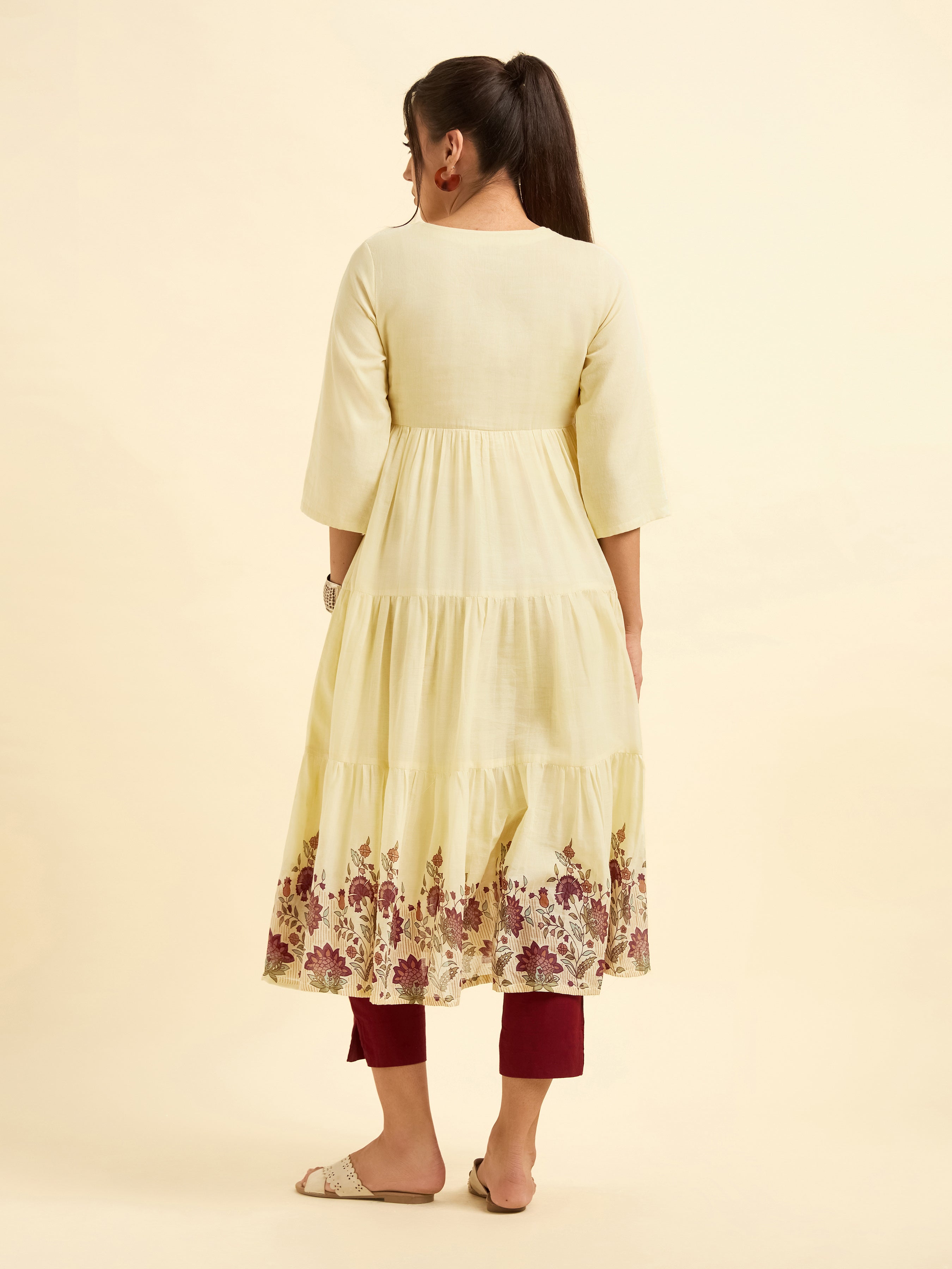 Pale Yellow Pure Cotton Tiered Kurti With Print And Embroidery