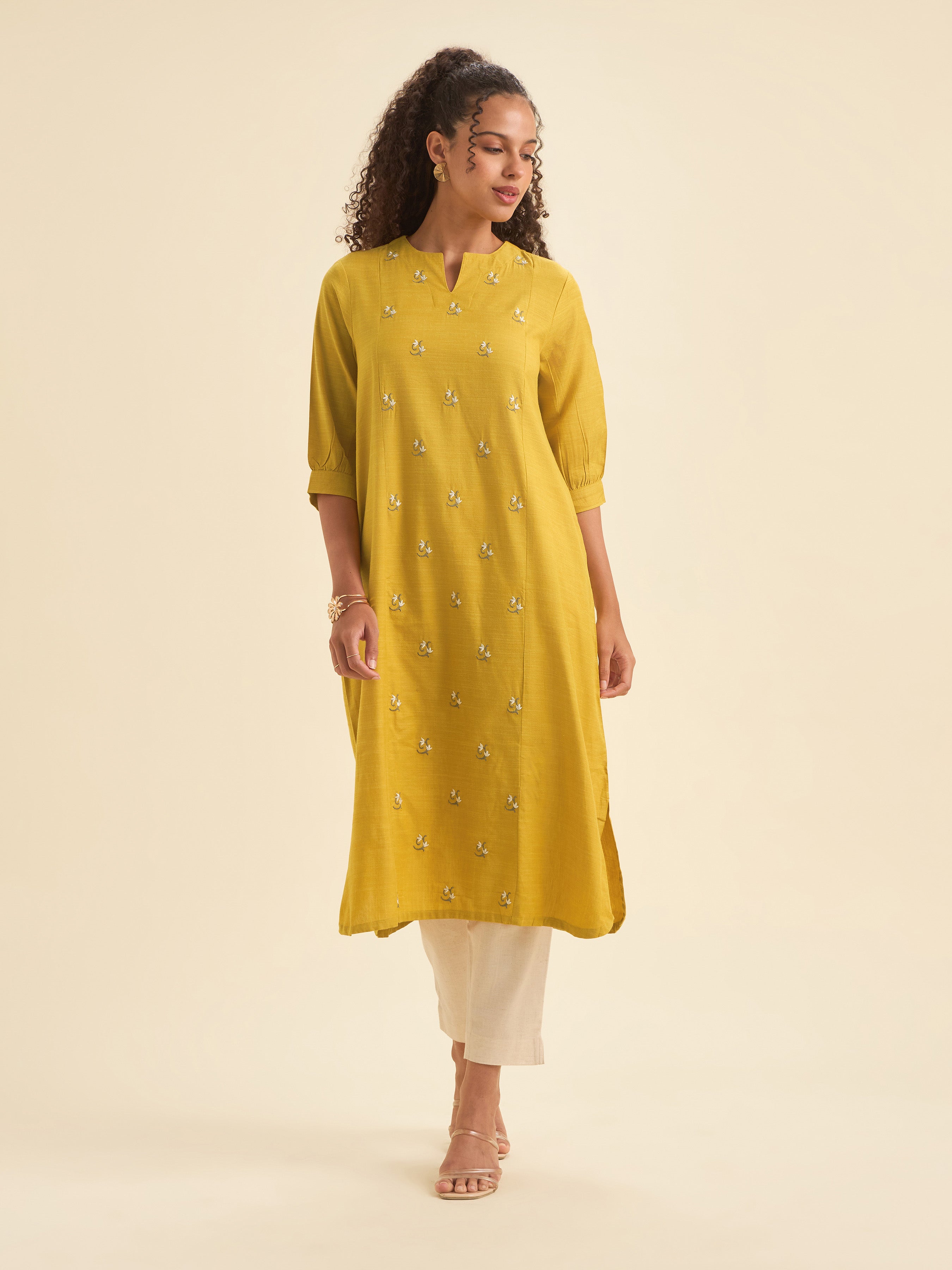 Mustard Cotton Viscose Slub Plain Flared Kurti With Curved Hem And Embroidery