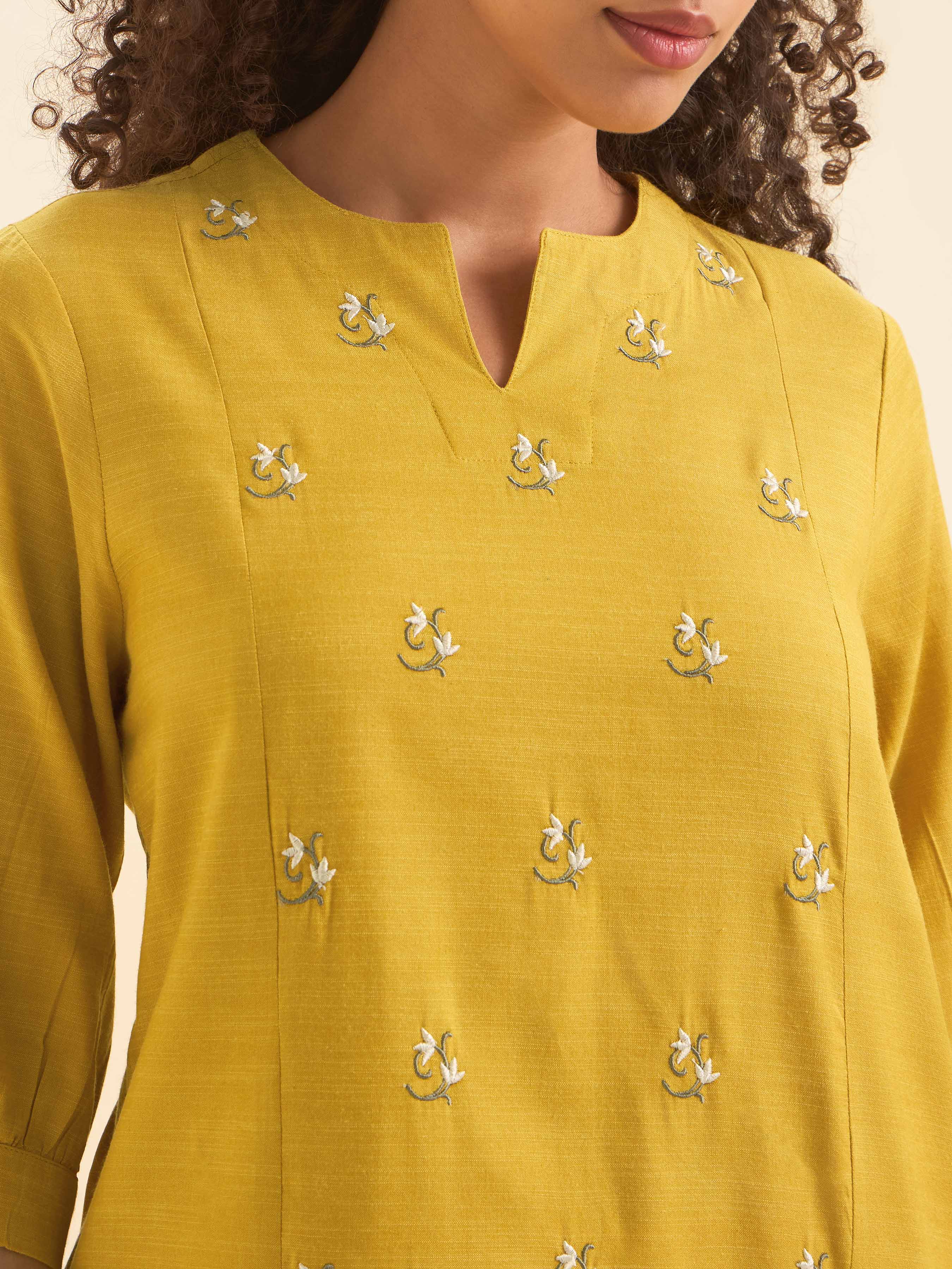 Mustard Cotton Viscose Slub Plain Flared Kurti With Curved Hem And Embroidery