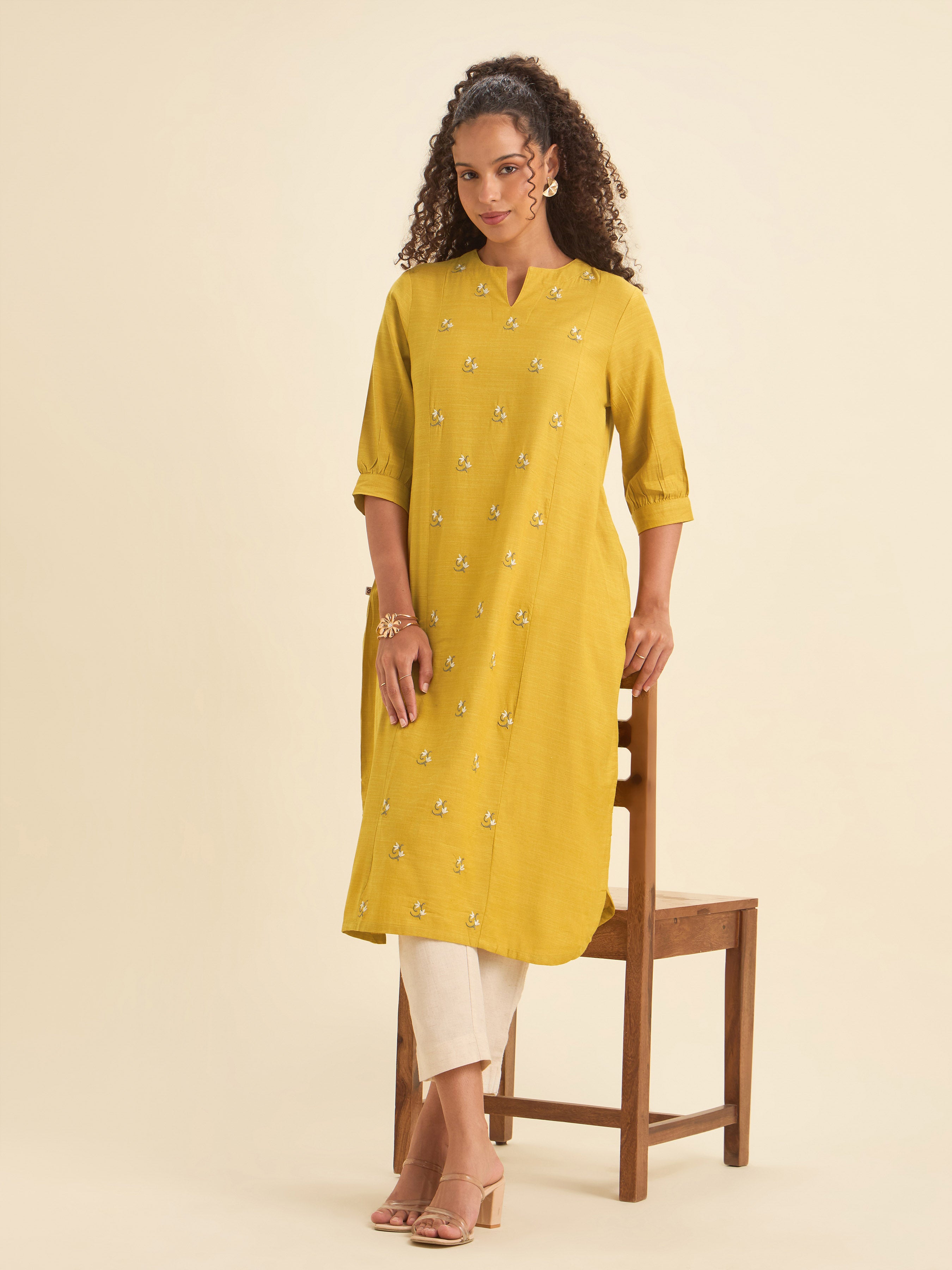 Mustard Cotton Viscose Slub Plain Flared Kurti With Curved Hem And Embroidery