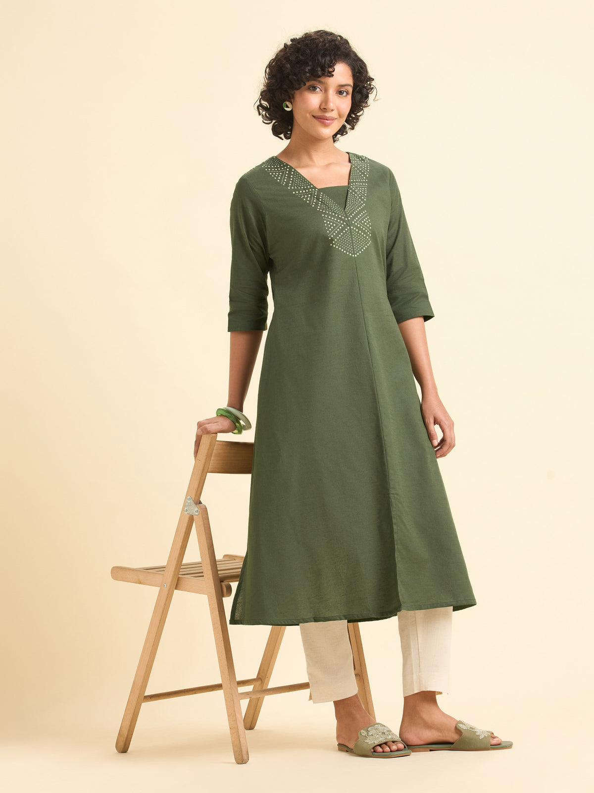 Olive Green Cotton Flared Centre Cut Kurti With Back Yoke And Placement Print