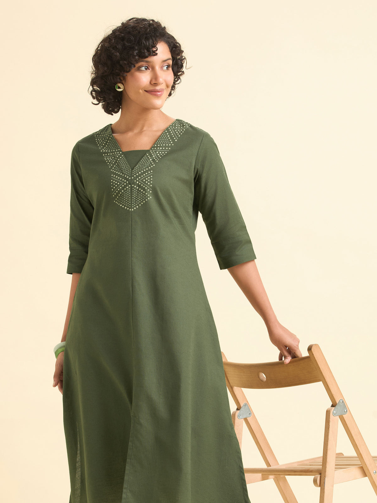 Olive Green Cotton Flared Centre Cut Kurti With Back Yoke And Placement Print