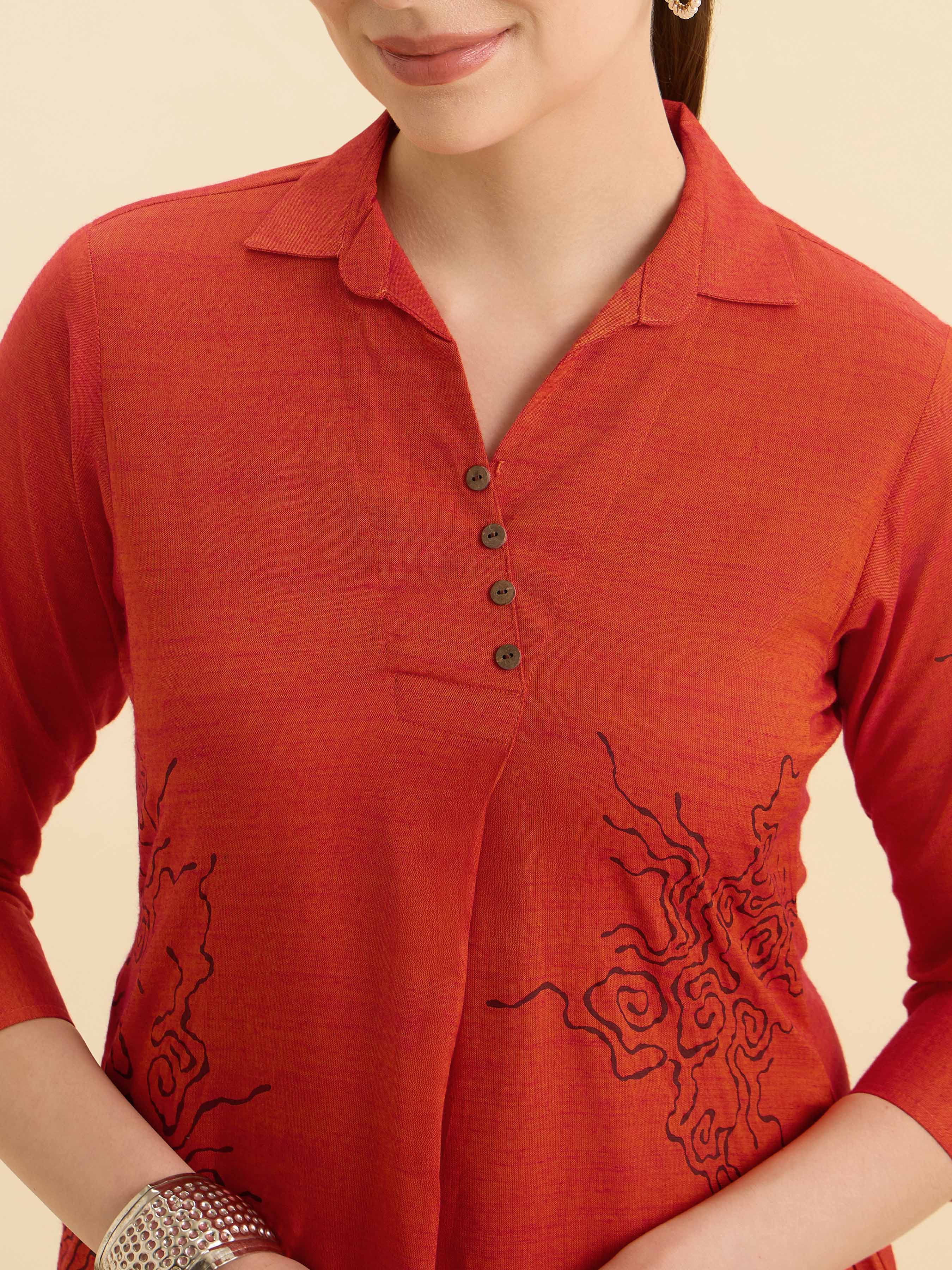 Orange Cotton Viscose Plain Slit Kurti With Placement Print, Knife Pleats & Curved Hemline